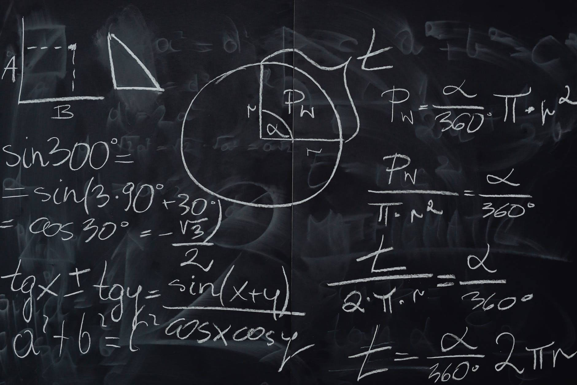 blackboard with handwritten calculations